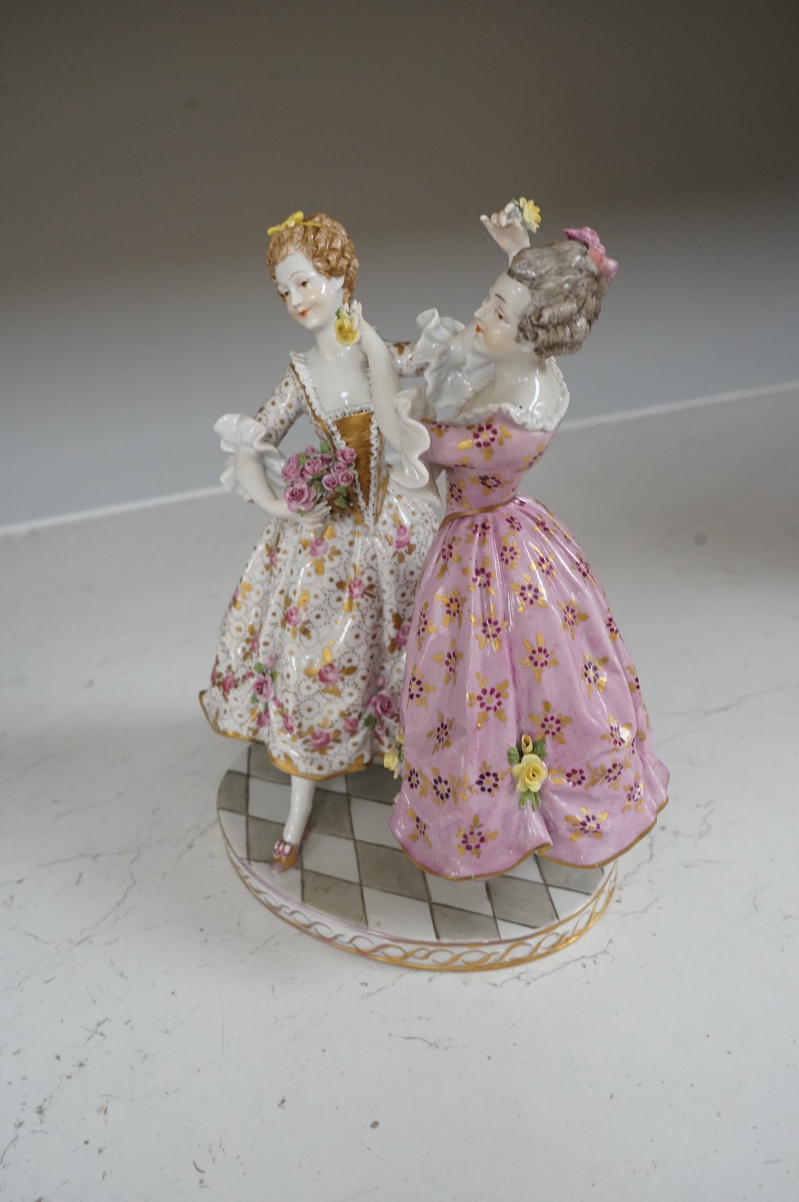 A Continental porcelain group of two dancers, 20cm high